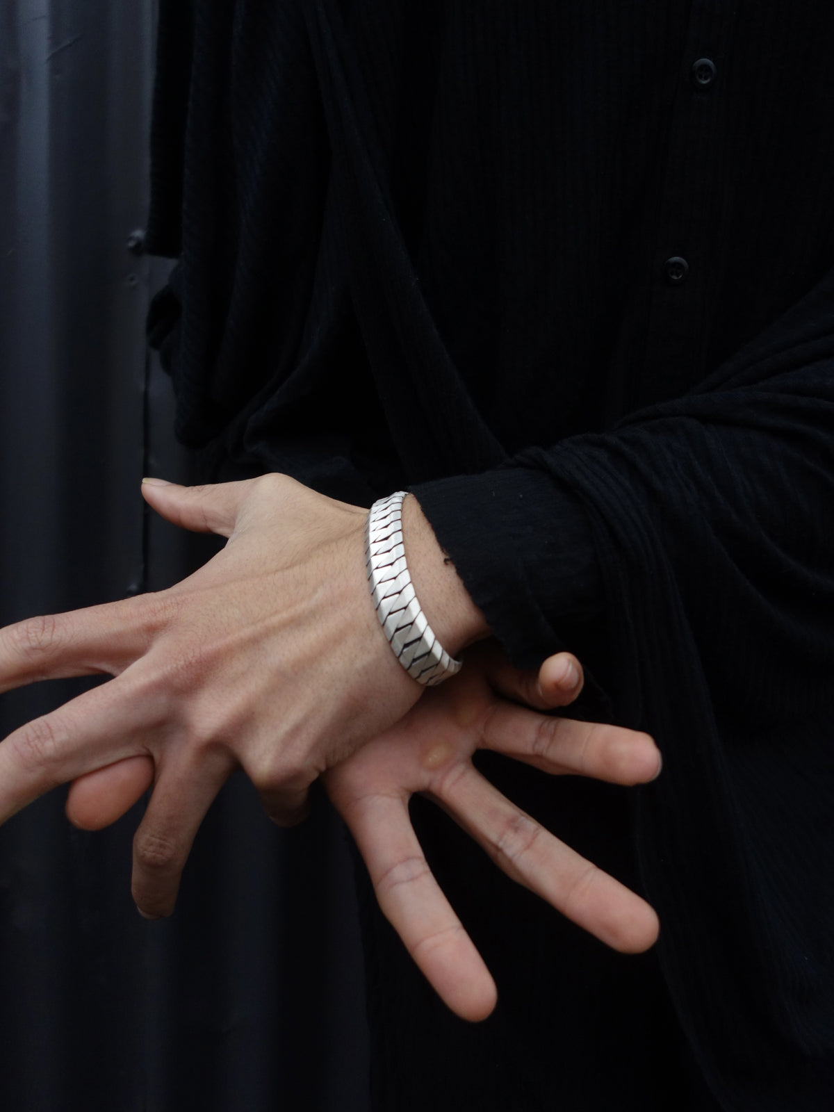 Chrome Blade Bracelet worn on the wrist, showing the chevron links running the length of the band