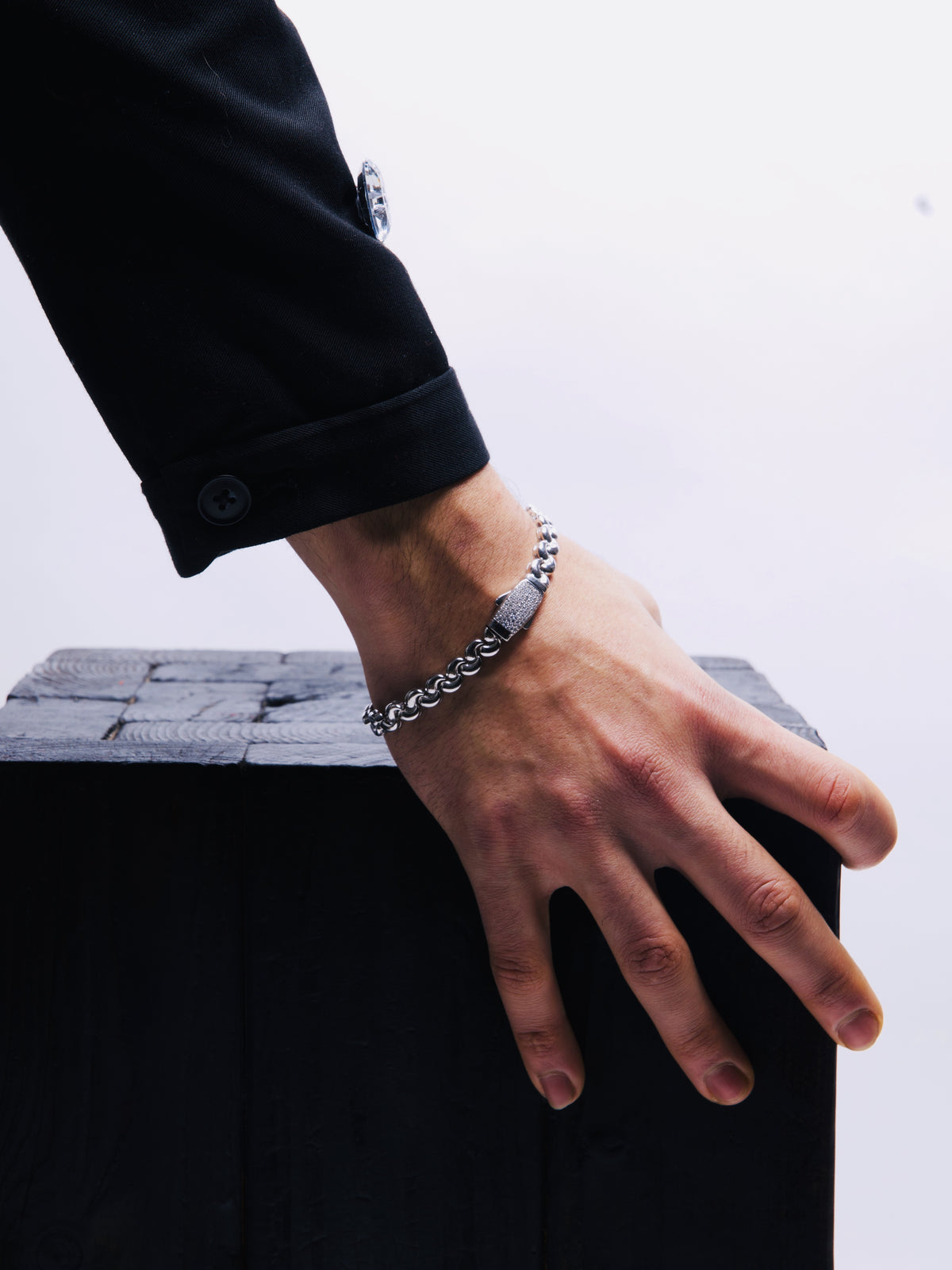 Ice Trap Bracelet worn on the wrist, showing the round-link band and the stone-set clasp